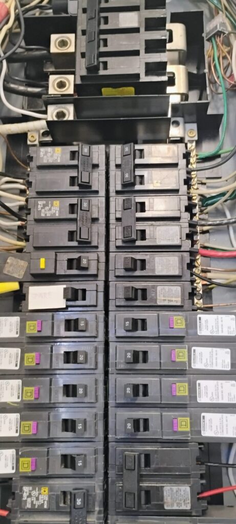 Picture of branch circuit breakers and main circuit breakers inside an electrical panel.
