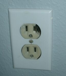 Picture of burnt electrical plug.
